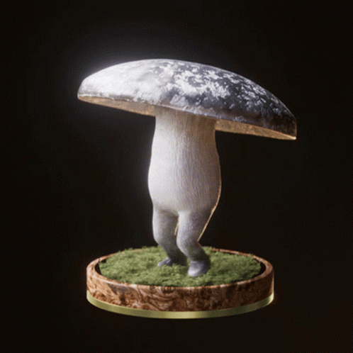 a stuffed mushroom standing on a small round platform