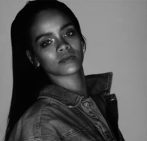 a black - and - white po of a young woman with a denim jacket on