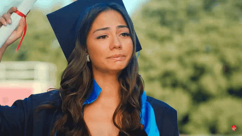 a woman wearing a graduation cap and gown