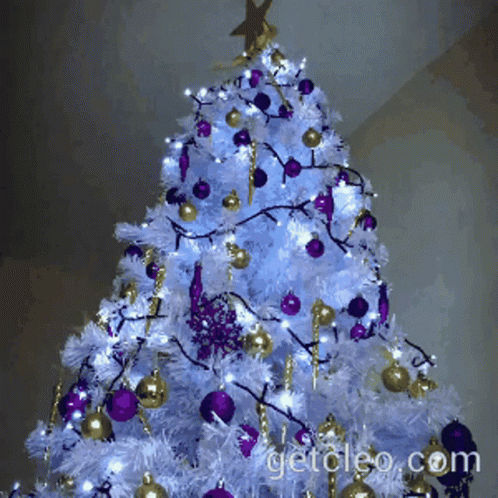 a decorated christmas tree with lights and ornaments