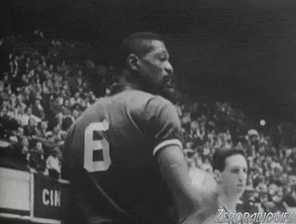 a black and white po of a man with a basketball