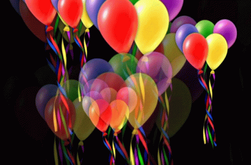 many balloons are floating in the air on a black background