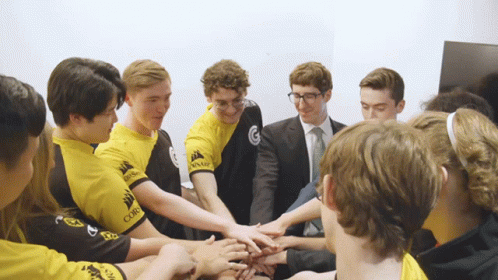 five young men are holding hands together as they shake hands
