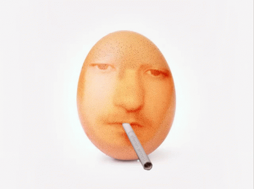 an egg with a straw sticking in it's mouth