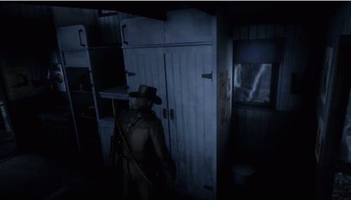 the creepy figure is standing by the door