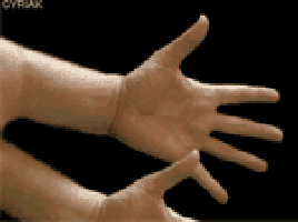 the hand is pointed at a computer screen