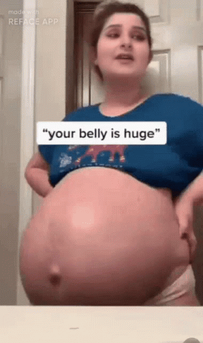 pregnant woman showing her belly with funny text message