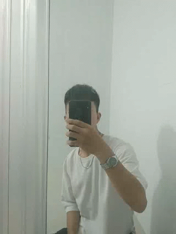 man taking a po in a mirror with a cell phone
