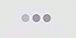 an image of a webcam taken at a white wall with three dots