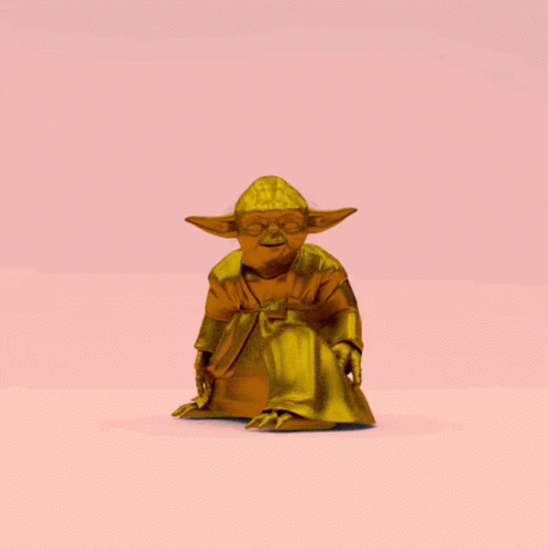 a statue of yoda sitting on a blue background
