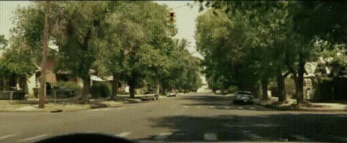 a car moving through a street in an intersection