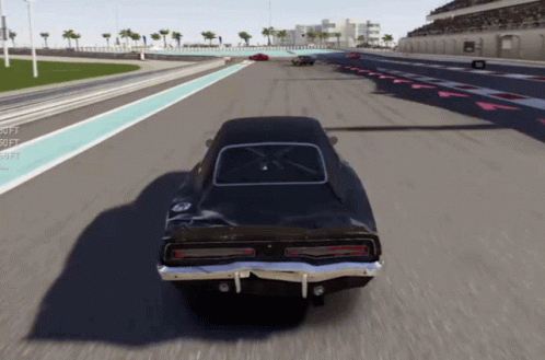 a car with a brown paint job drives down the racetrack