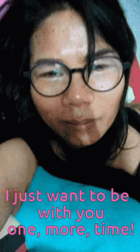 a girl is lying down with glasses and an interesting phrase