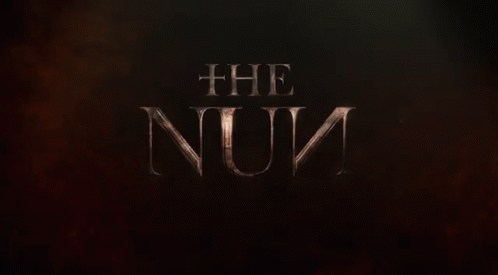 a dark screen s shows the letters'the nun '
