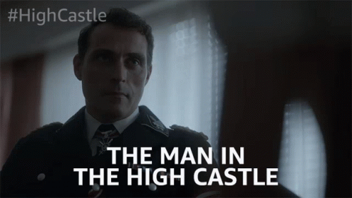 the man in the high castle is shown as he stands behind a wall