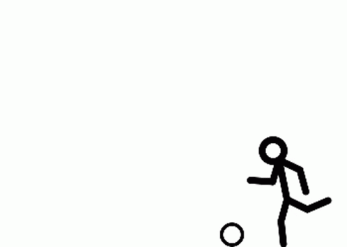 a man is kicking a soccer ball with his right foot