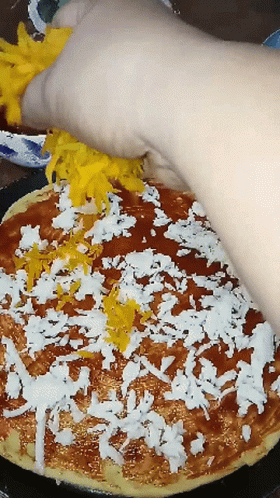 a large piece of cake with sprinkles is being cut