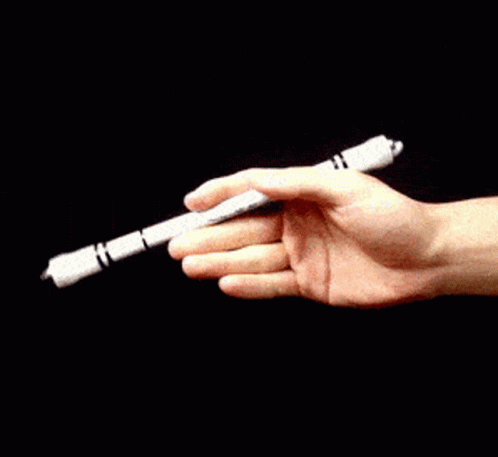 a blue hand holding a white plastic pipe