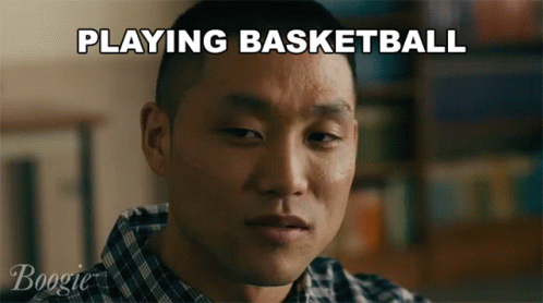 an asian man is playing basketball on the television