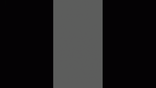 a tall, black column in the middle of a room
