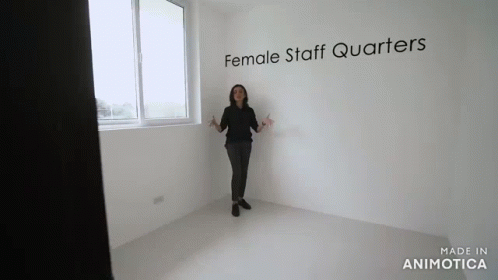a person standing in front of a window with the words female staff quarters written on it