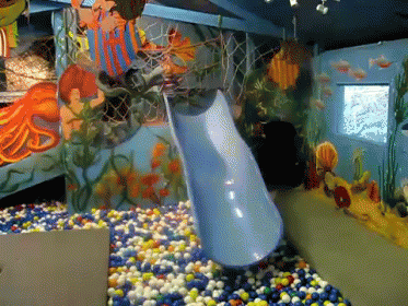 a living area with colorful aquariums and a fish tank