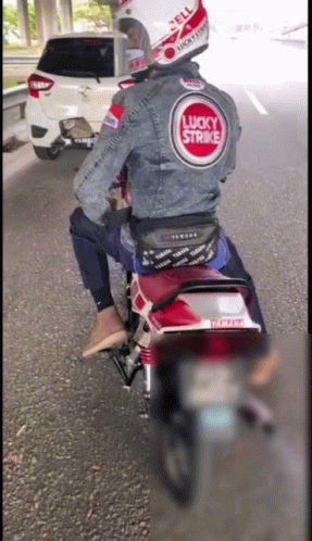 a man in a helmet is riding on his motorcycle