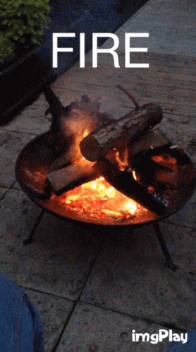 a fire ring sitting on top of a stone ground