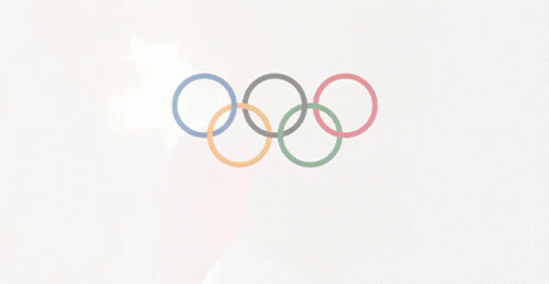an olympic sign is shown on the background of a cloudy sky