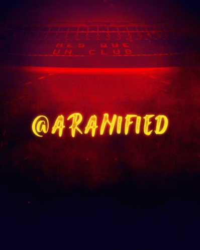 neon sign in front of a computer keyboard, showing the word caranfied