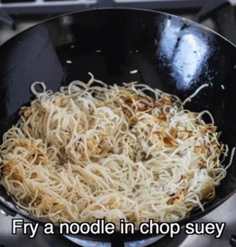 there is noodles in a pan sitting on the stove