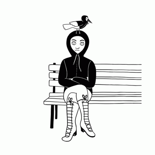 woman sitting on bench wearing a bird costume
