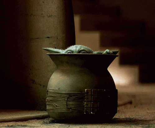 a baby yoda star wars ceramic pot is shown in this still image