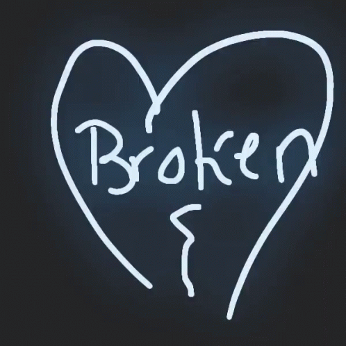 a broken heart in a black room with the word broken written inside