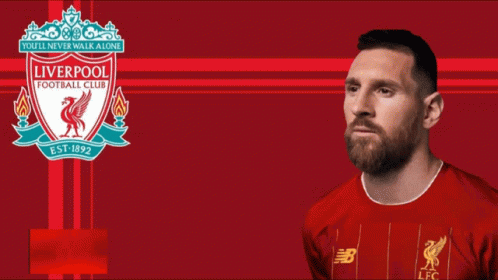 a man with a goatee wearing a blue liverpool shirt