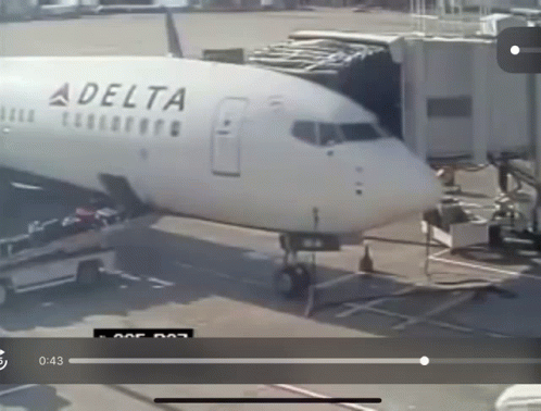 a plane with its door open is being unloaded at the airport