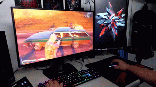 a person playing games on a computer at a desk