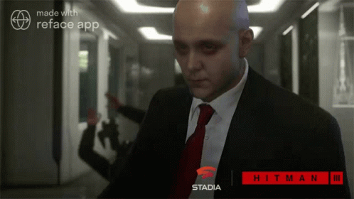an image of a bald man walking down the hallway