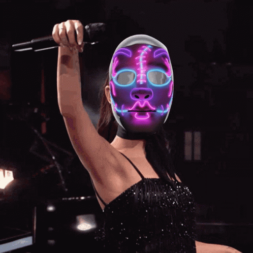 the lady is wearing a pink mask with lights on