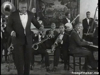 an old black and white po shows a orchestra with a trumpet