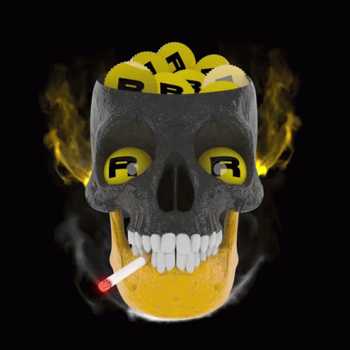 a skull is lit with a cigarette next to it