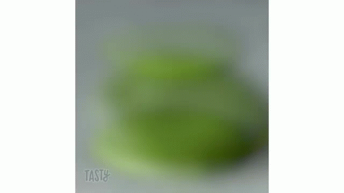 a blurry po of a green vase