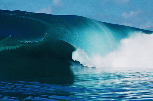 the view of a massive wave from within a barrel