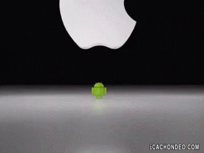 a picture of a small green object that appears to have fallen out of a black background