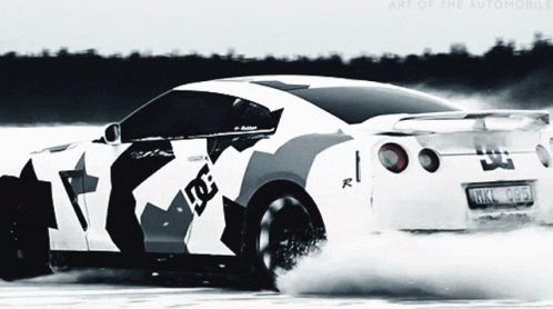 the sports car has painted white and black with an abstract design