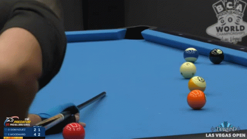 a table topped with lots of balls and darts