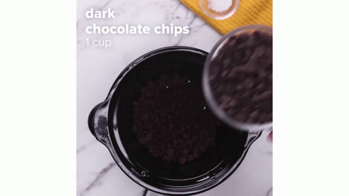 the dark chocolate chips is in an ice cream maker