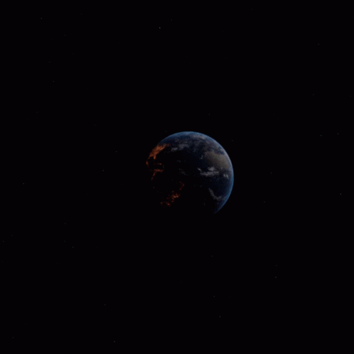 an orange moon and a black background, taken from earth