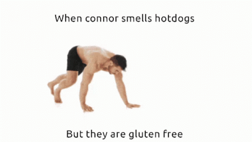 someone is bending over doing a yoga position with the words, when cornor smells  dogs but they are gluten free