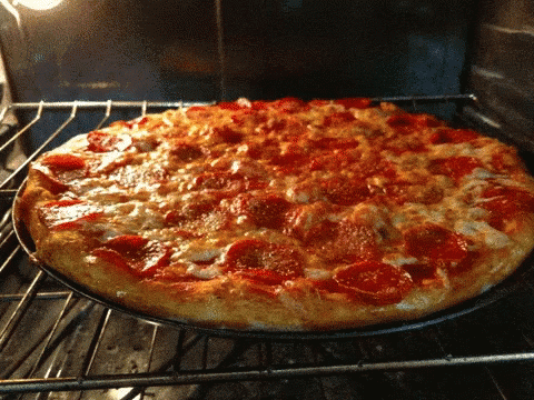 a homemade pizza in the oven is blue